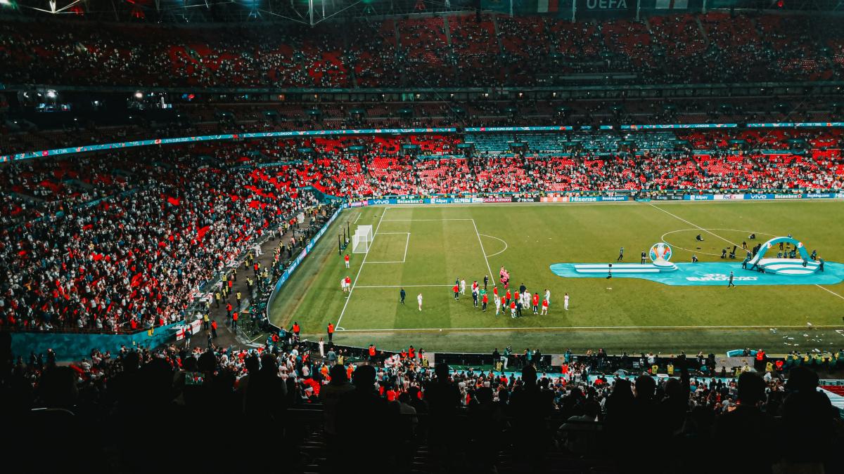 people watching football game on stadium