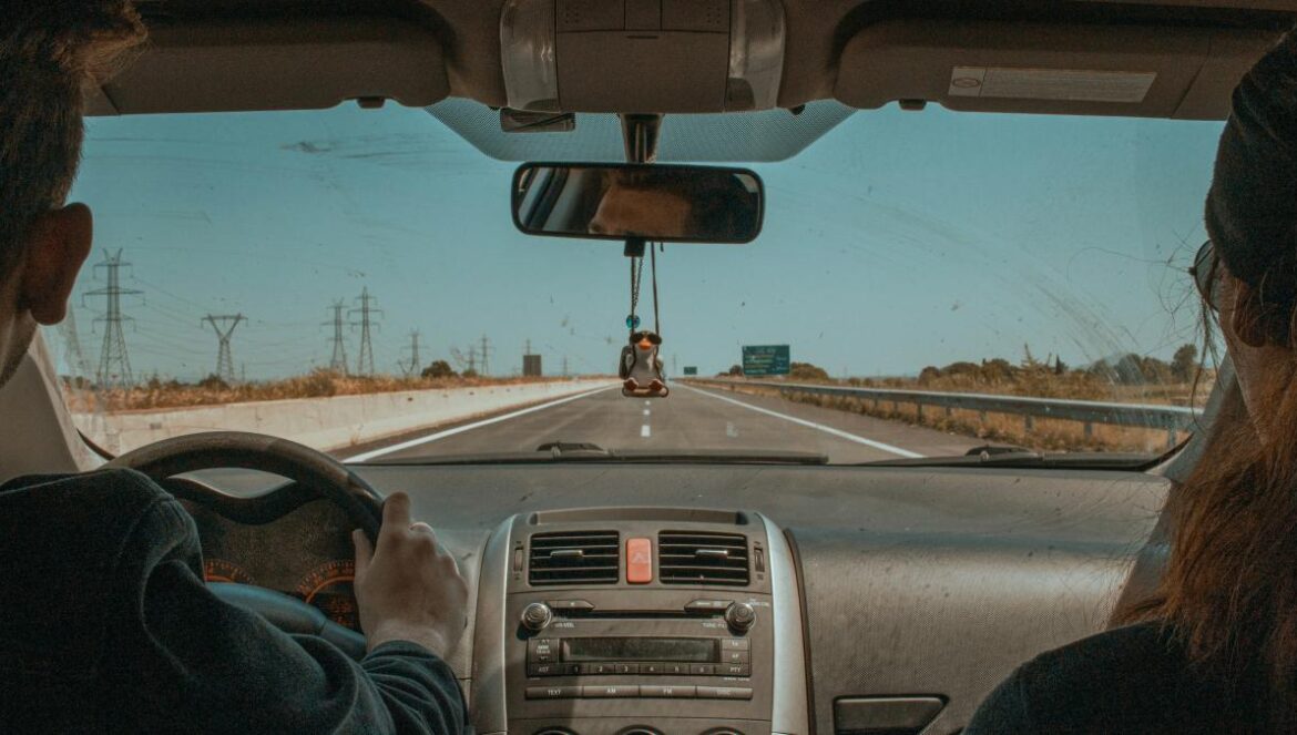 a couple of people that are in a car