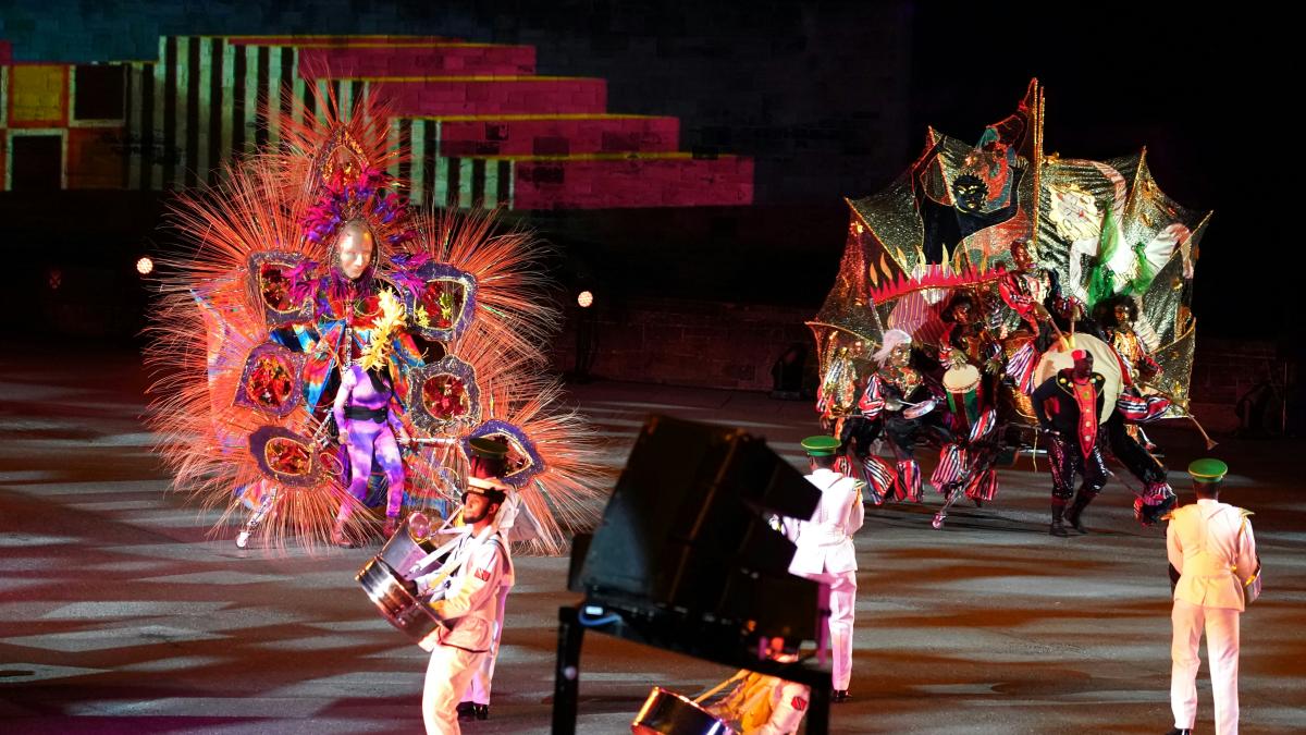 a group of people standing on top of a stage