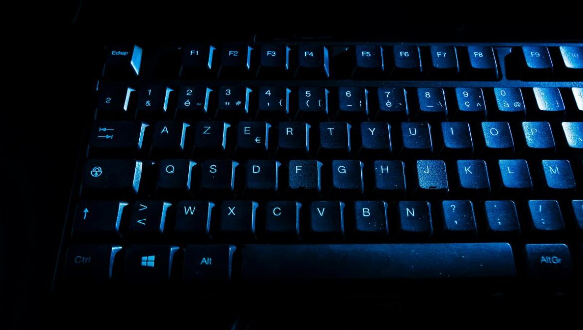 a close up of a keyboard in the dark