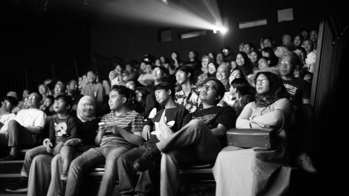 A black and white photo of a crowd of people