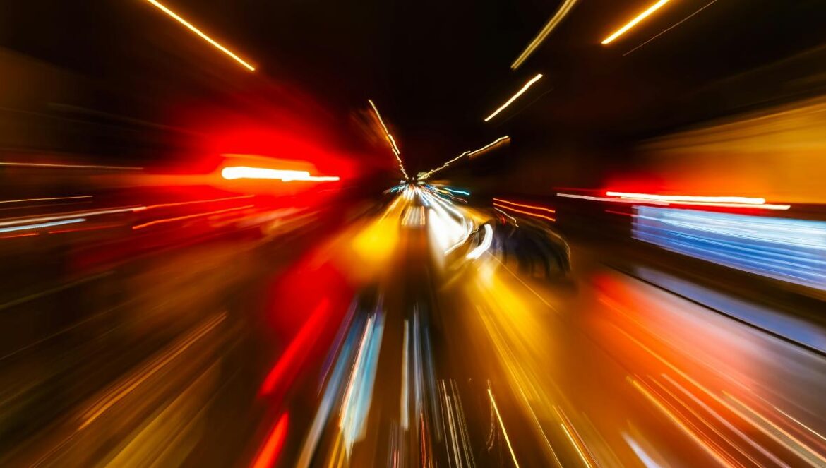 a blurry photo of a city street at night