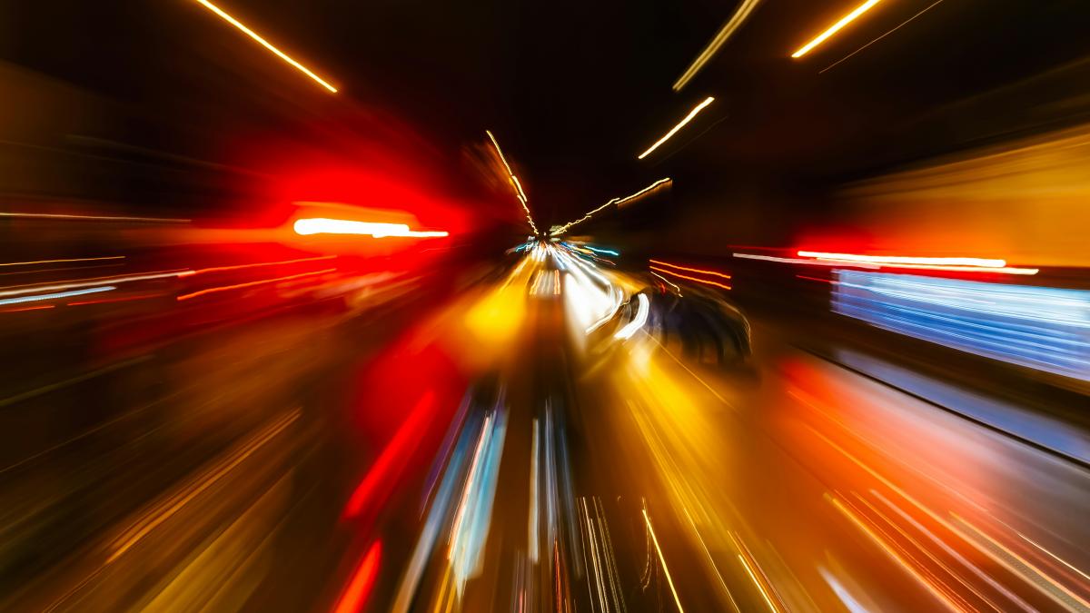 a blurry photo of a city street at night