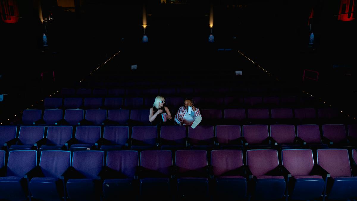 A couple of people sitting on top of a stage