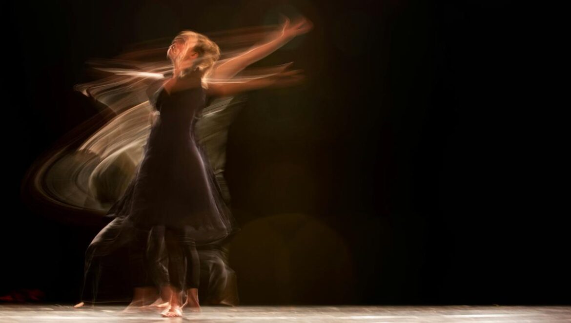 a couple of people that are dancing on a stage