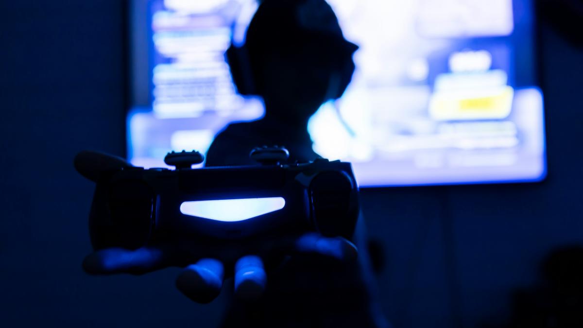 silhouette of man holding gun