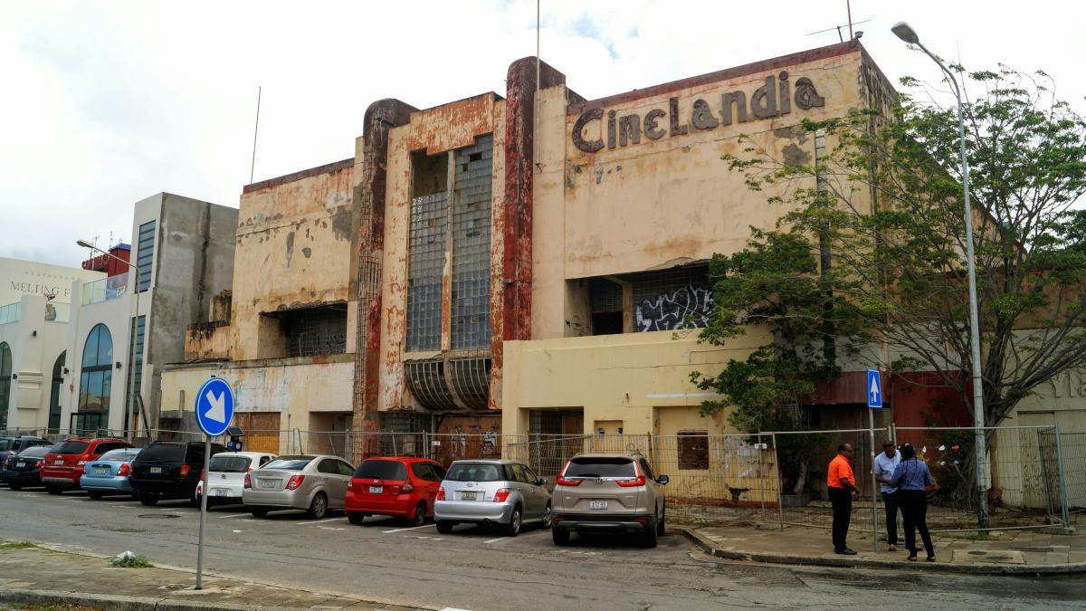 a building with cars parked in front