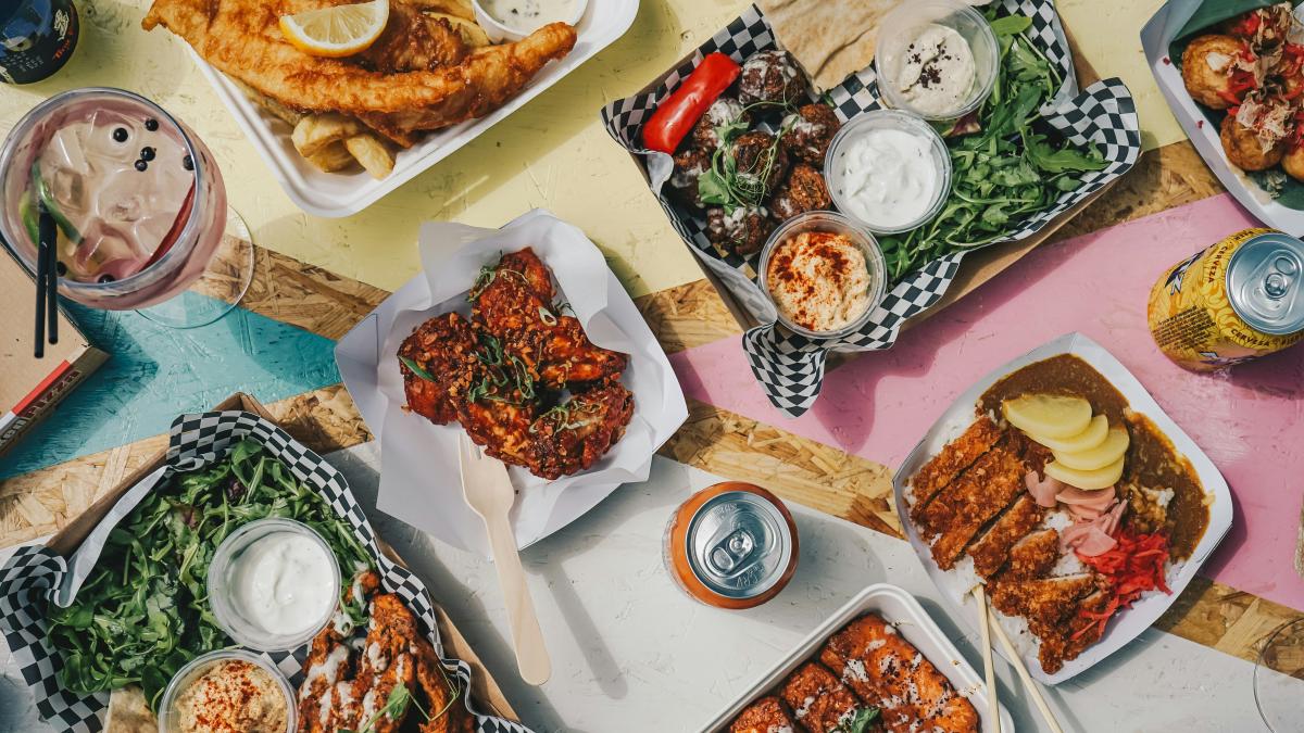 a table topped with plates of food and drinks