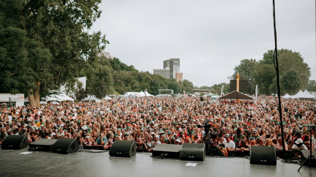 a large group of people sitting on a stage