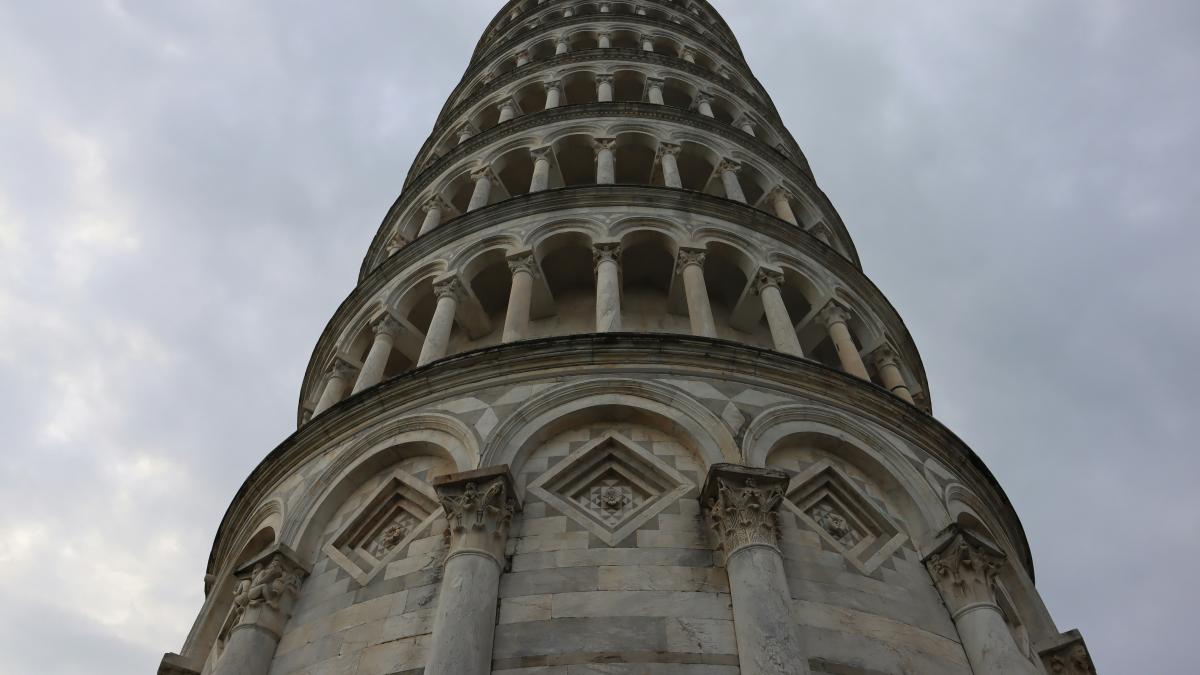 a very tall tower with a clock on it's side