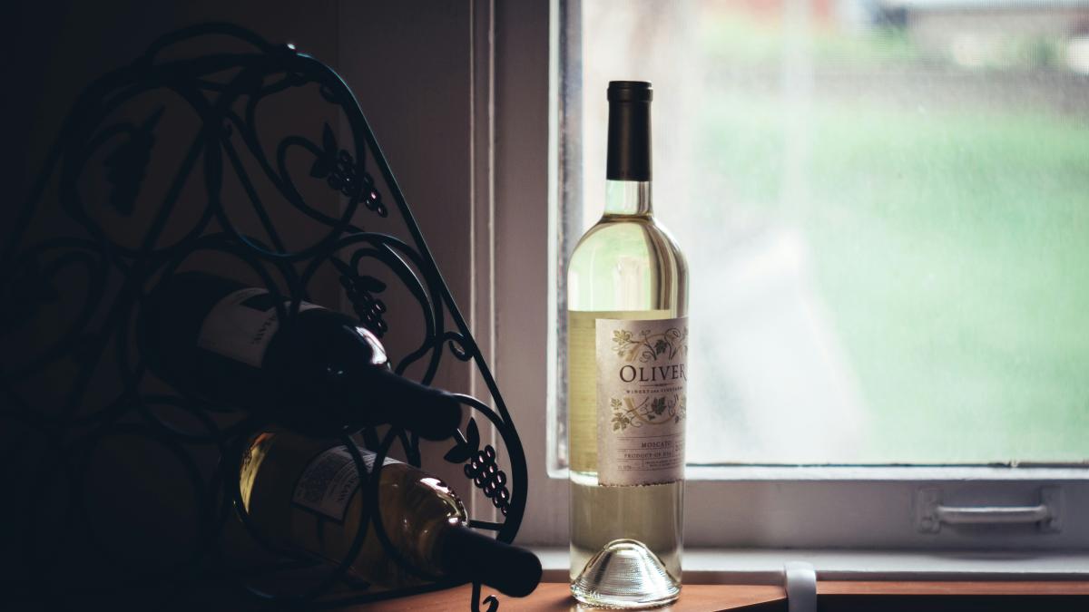 clear glass bottle near window