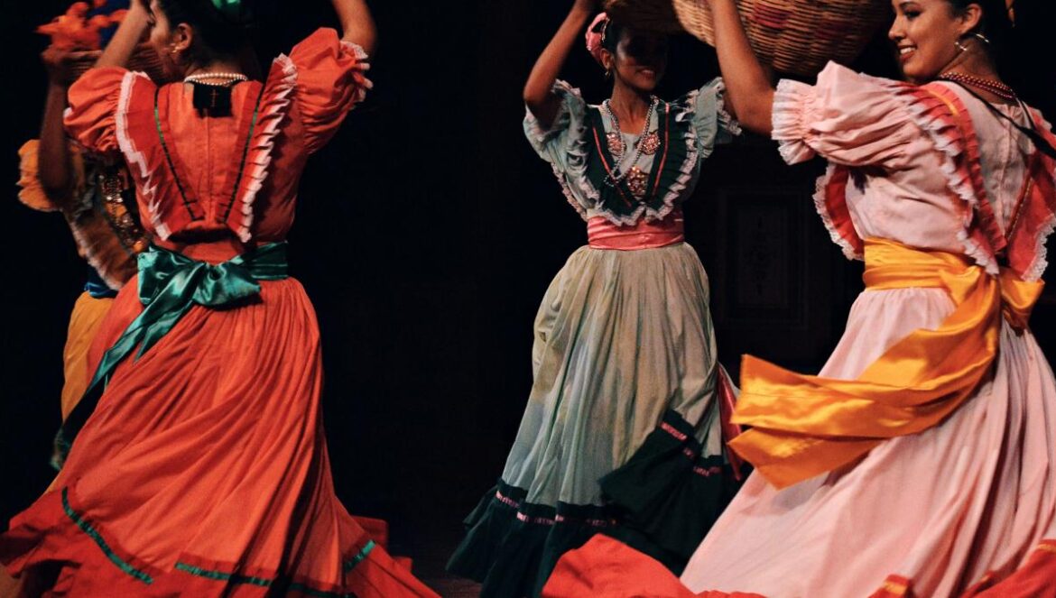 women in green and brown dress dancing