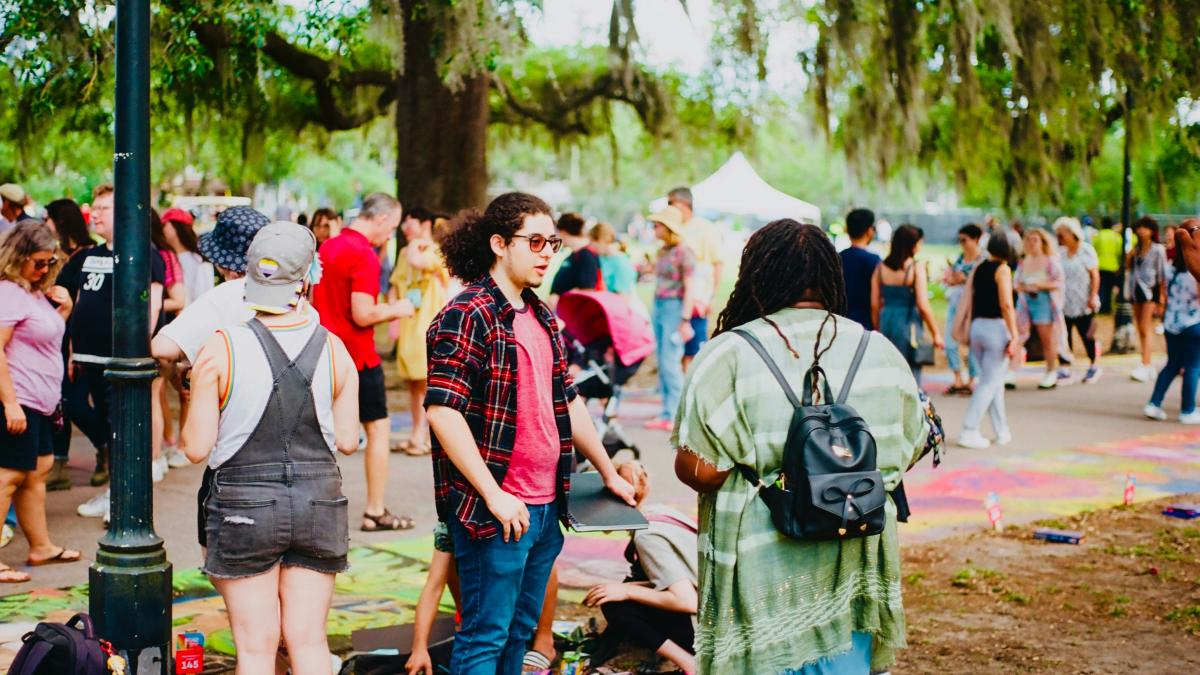 a group of people walking in a park