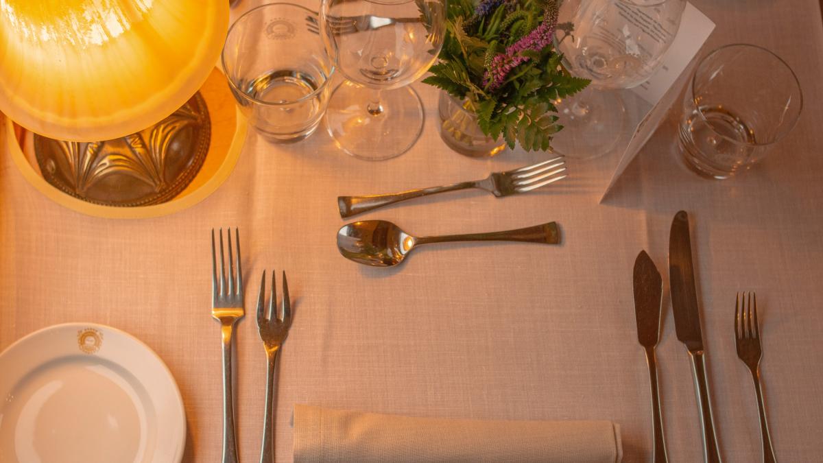 a table is set with silverware and silverware