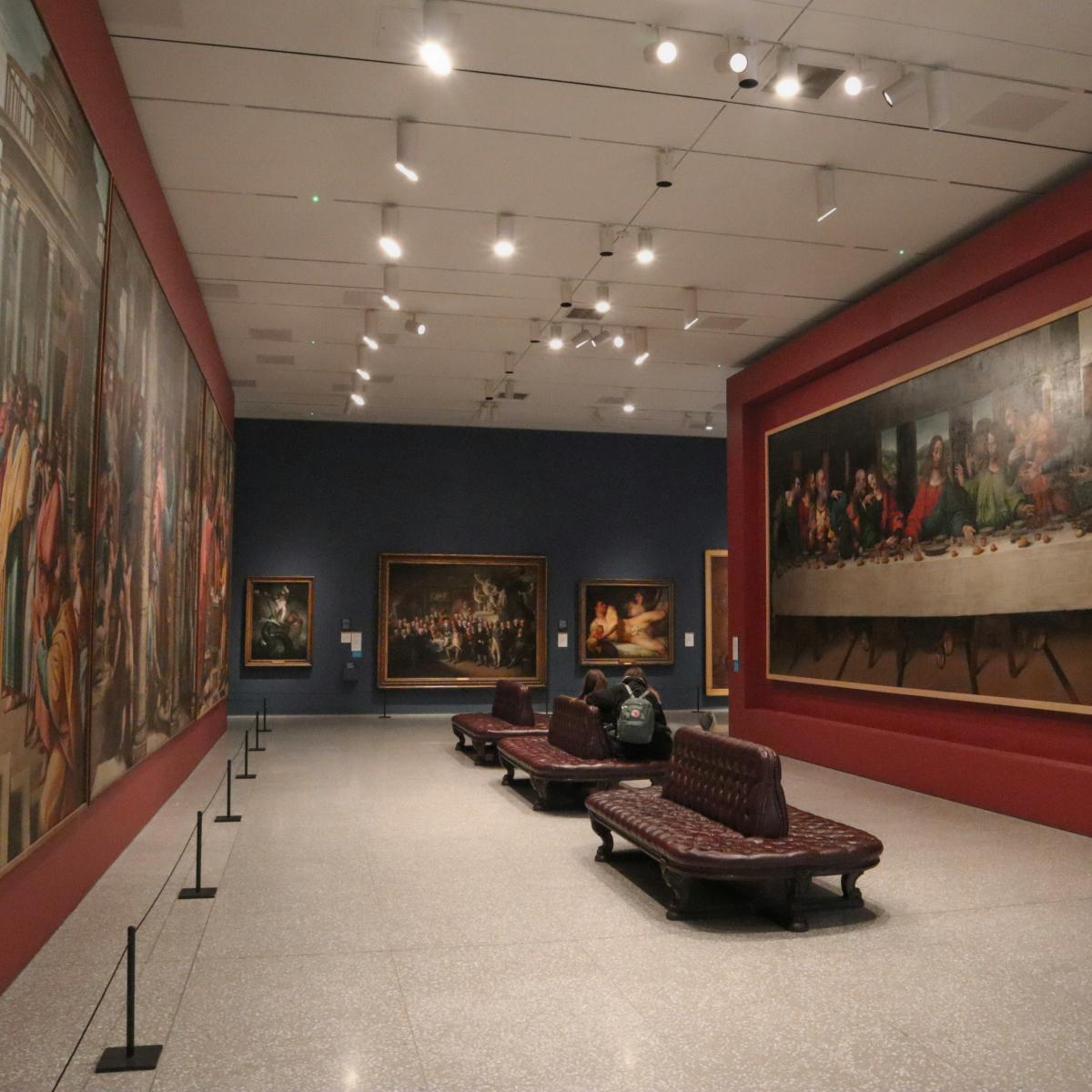 woman in black shirt sitting on brown wooden bench